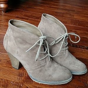Brown/tan lace up heeled booties.